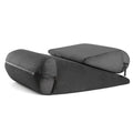 High density sponge triangular support pillow in various colours on a sofa.