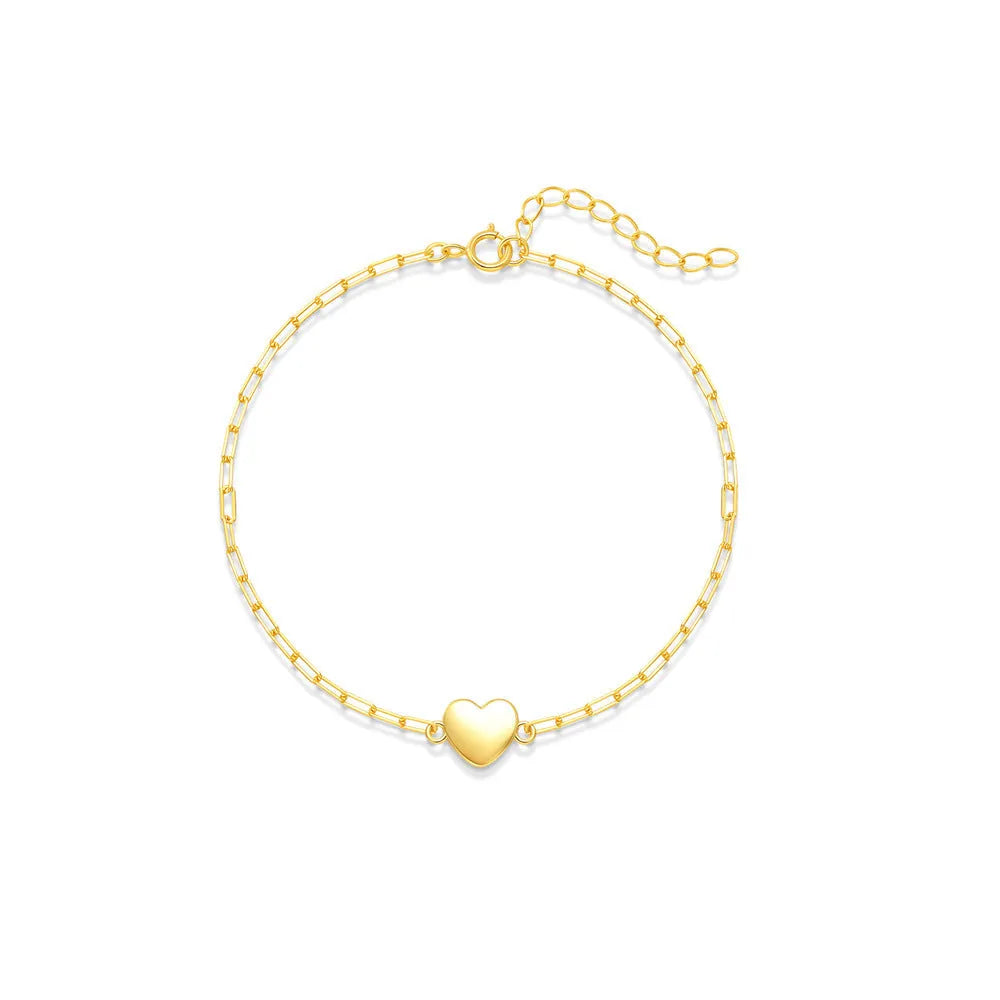 Gold tone S925 sterling silver bracelet with glossy heart charm and clip chain fastening