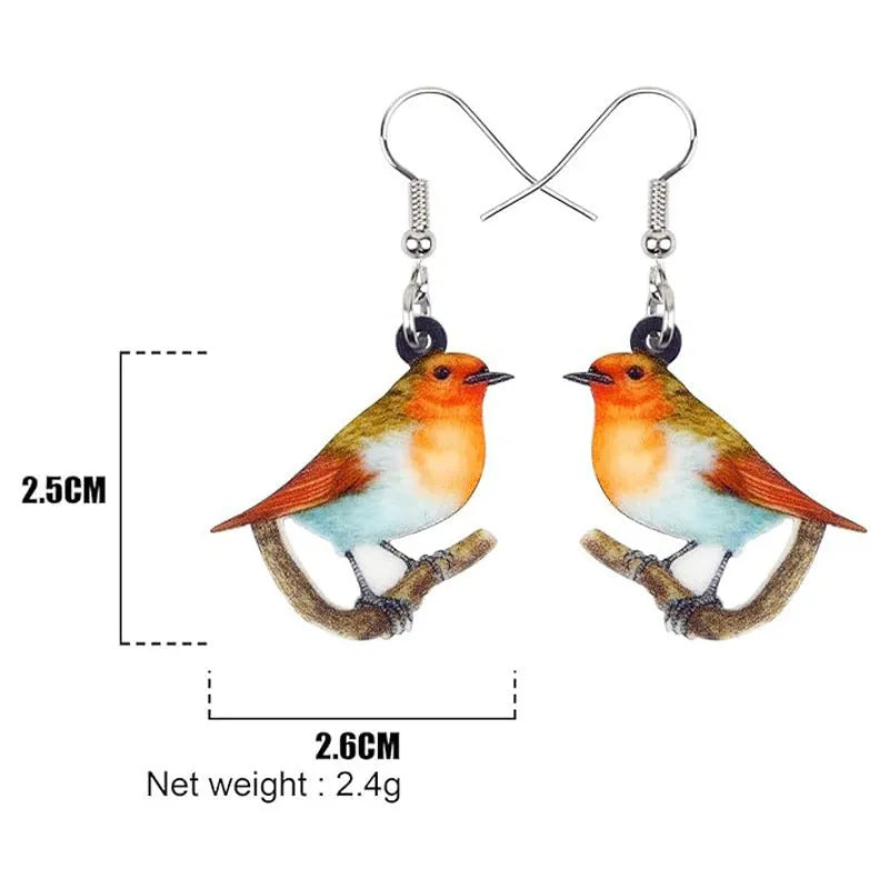 Close-up of blue titmouse and snake geometric design on women's acrylic pendant earrings.