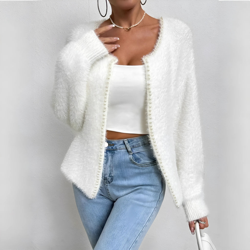 White women's V-neck cardigan sweater with bead-knit texture on a hanger.