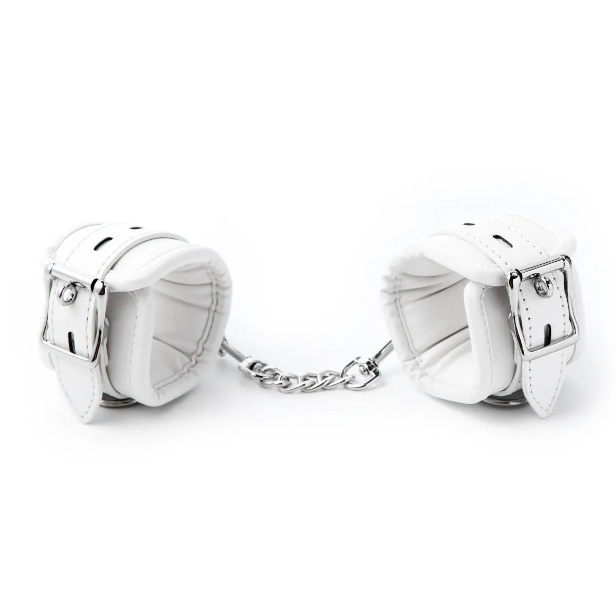 White PU foam bondage set showing handcuffs, ankle cuffs, and a neck scarf on a dark background.