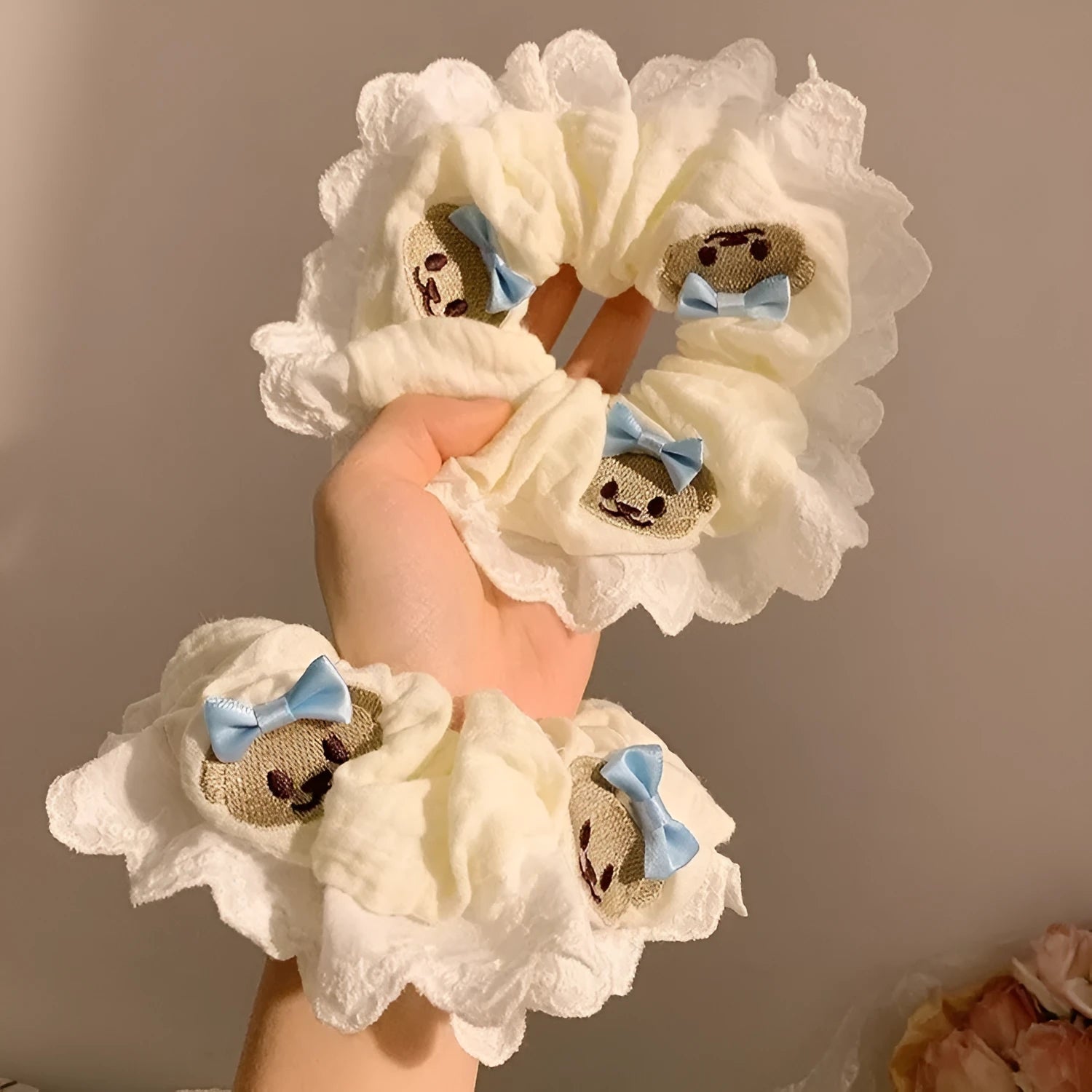 Bear blue cloth hair ring with bow and lace trim on elasticated large intestine headband
