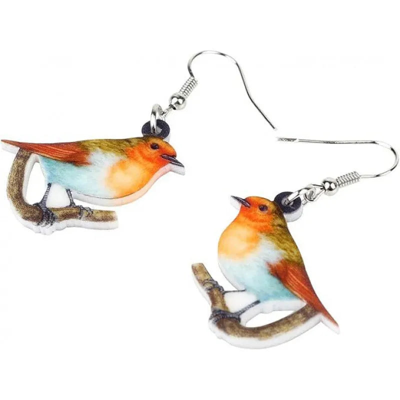 Close-up of blue titmouse and snake geometric design on women's acrylic pendant earrings.
