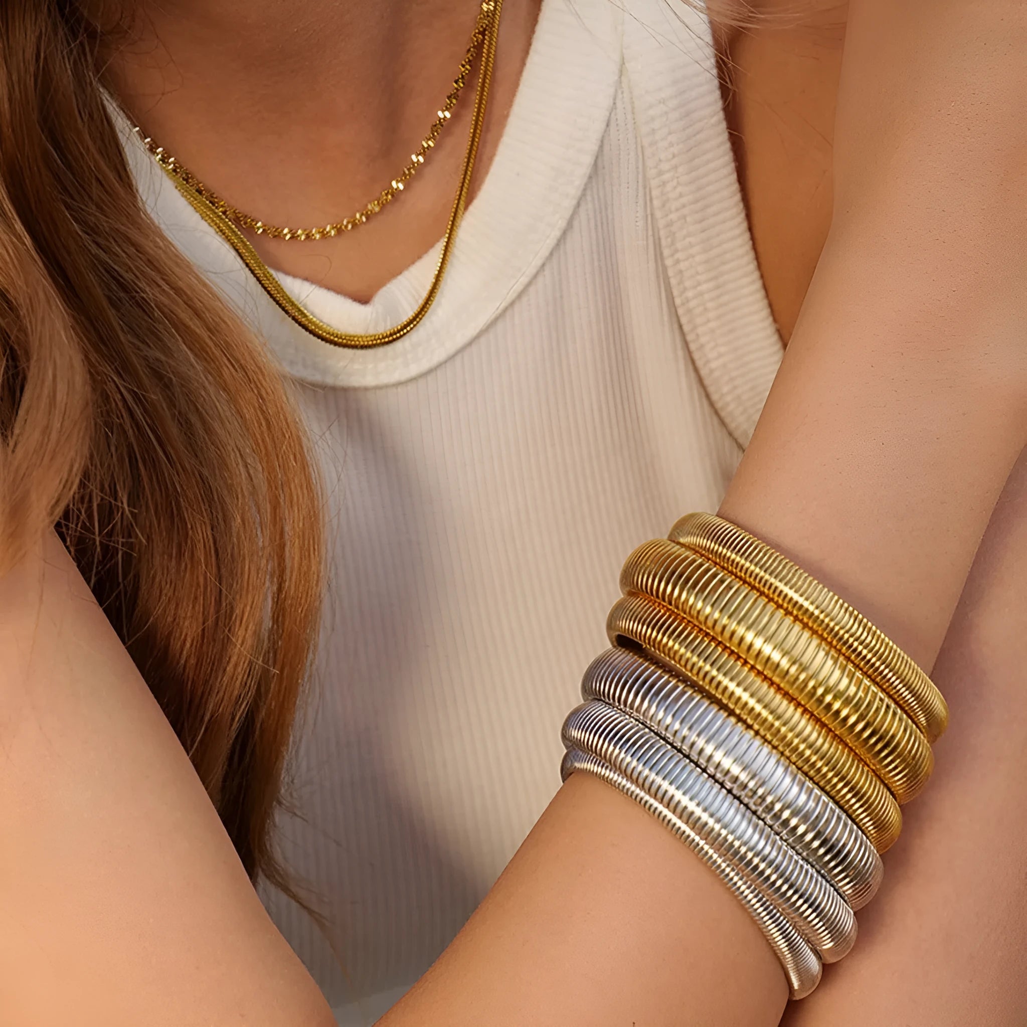 Women's titanium steel bracelet with vertical stripe ring design in gold or silver colour