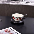 Antique style ceramic coffee cup and saucer set in black or orange, 210ml capacity.