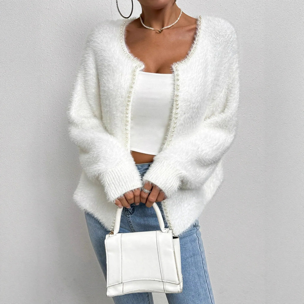 White women's V-neck cardigan sweater with bead-knit texture on a hanger.