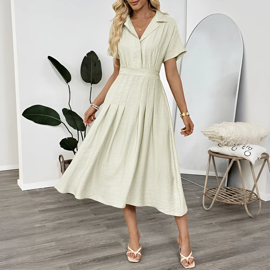 Light green shirt dress with lapel collar, waist tie, and side pockets