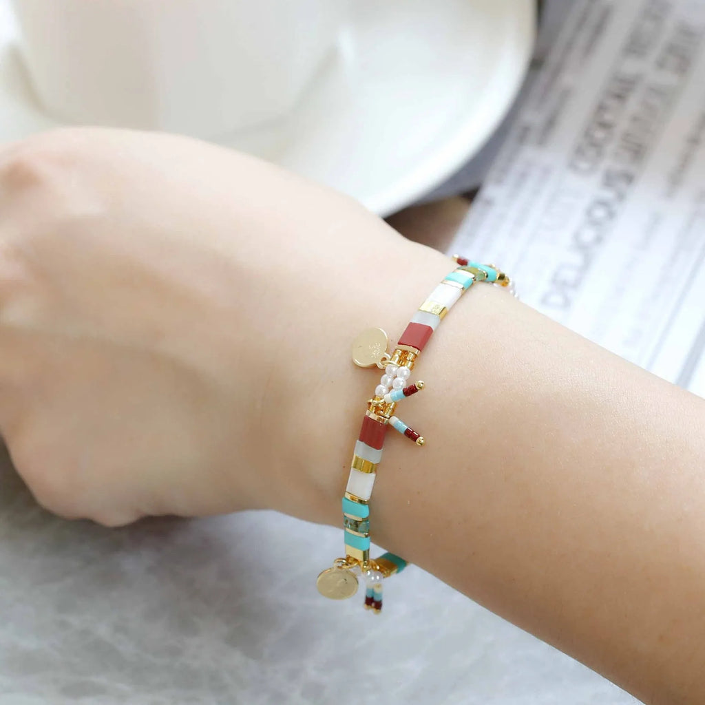 Women's handmade imitation pearl beaded bracelet with adjustable clasp in a choice of six colours.