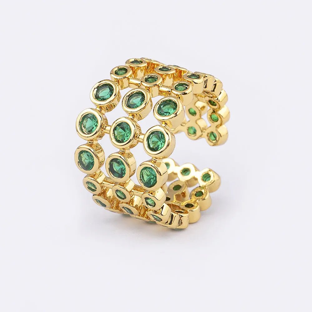 Three-layer wide band statement ring with green zircon stones and gold plating on copper base