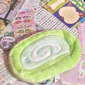 Korean style velvet pencil case designed like a swiss roll cake for stationery storage.