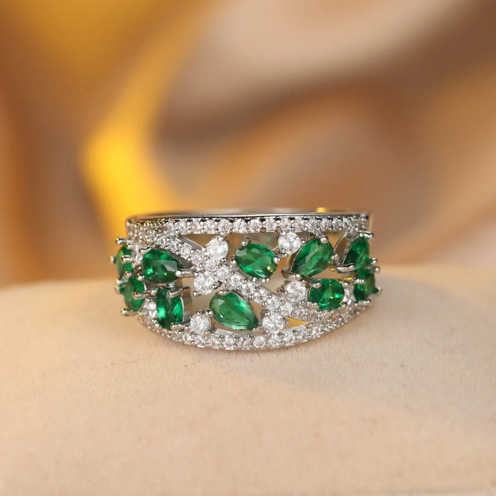 A women's hollow round copper fashion ring shown in a choice of platinum and gold finishes with white or blue accents.