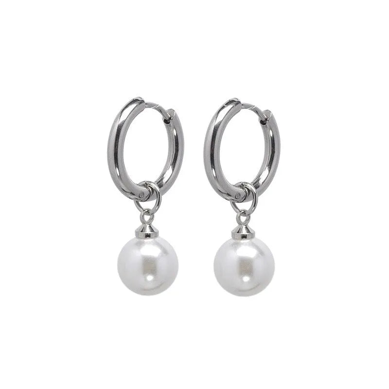 A pair of women's pearl-coloured alloy geometry drop earrings with a hip hop style.