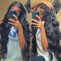 Black synthetic curly wig with front lace and side bangs, shown in long lengths.