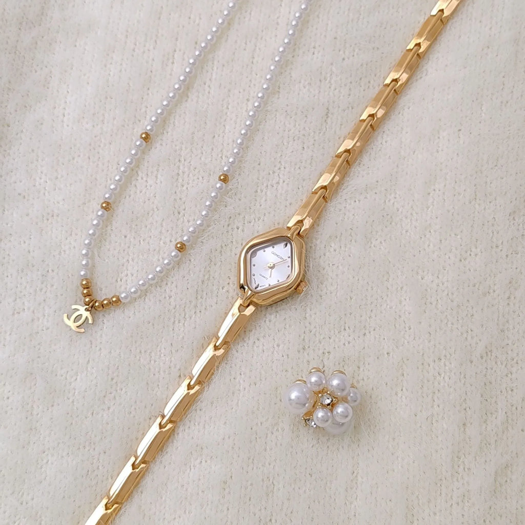 Ladies diamond fashion watch with gold or silver finish and chain strap, showing 7mm thickness and mineral glass face