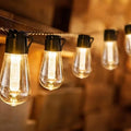 Waterproof outdoor string lights with retro long bulb bottle shape in garden setting