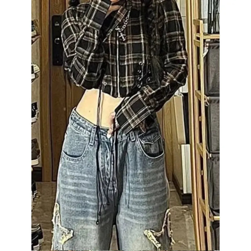 Blue women's high waist straight-leg jeans made from cotton denim on a neutral background.