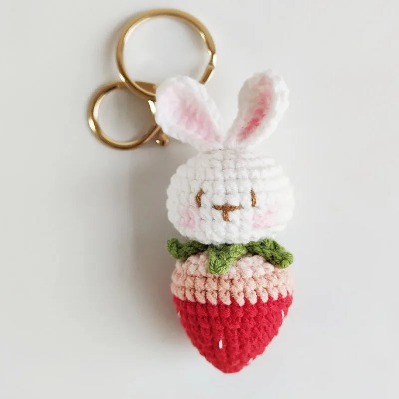 Hand-woven colourful wire pendant shaped like a rabbit with a strawberry, featuring a key loop.