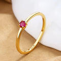 Copper geometric fine circle ring for women with a single diamond, shown in blue colour.