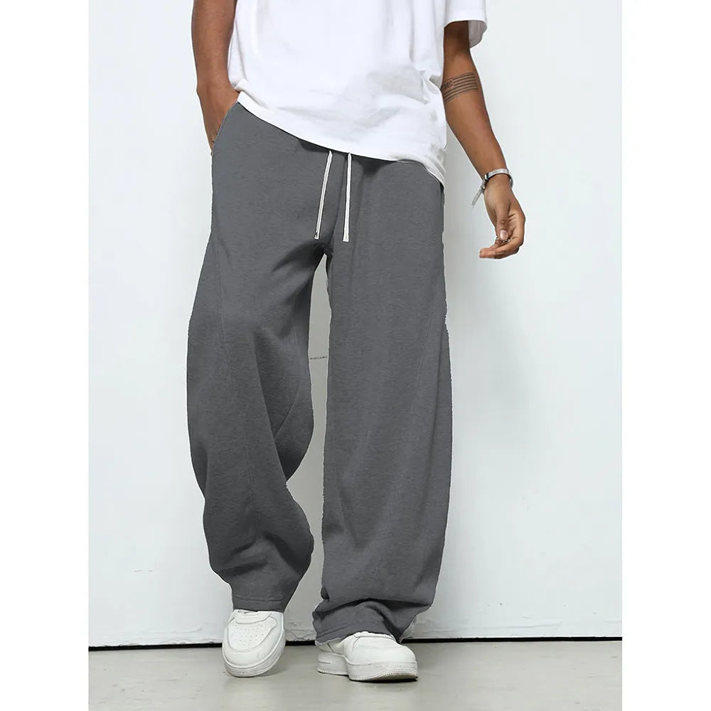 Men's straight-leg polyester casual trousers in black with a drawstring elastic waistband.