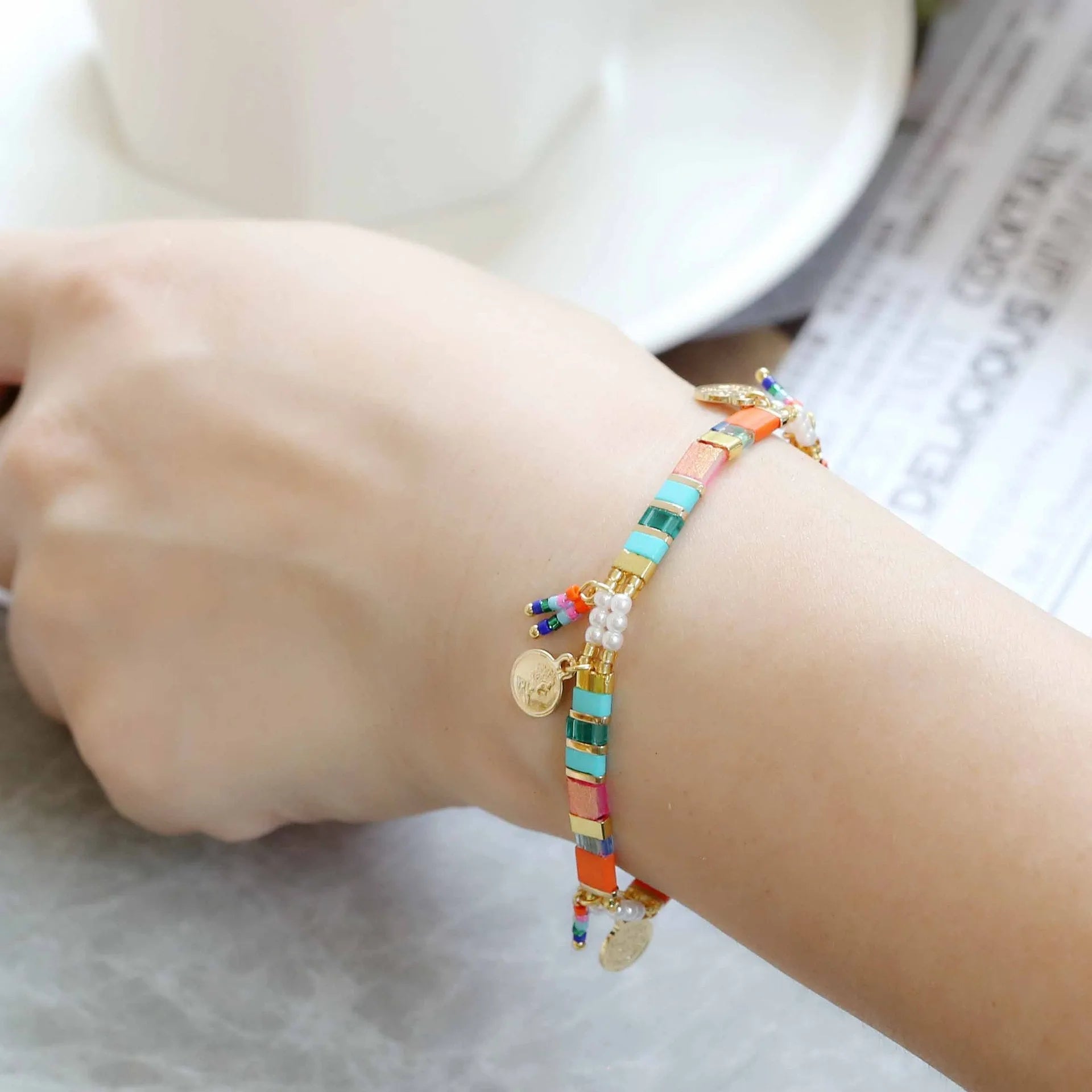 Women's handmade imitation pearl beaded bracelet with adjustable clasp in a choice of six colours.
