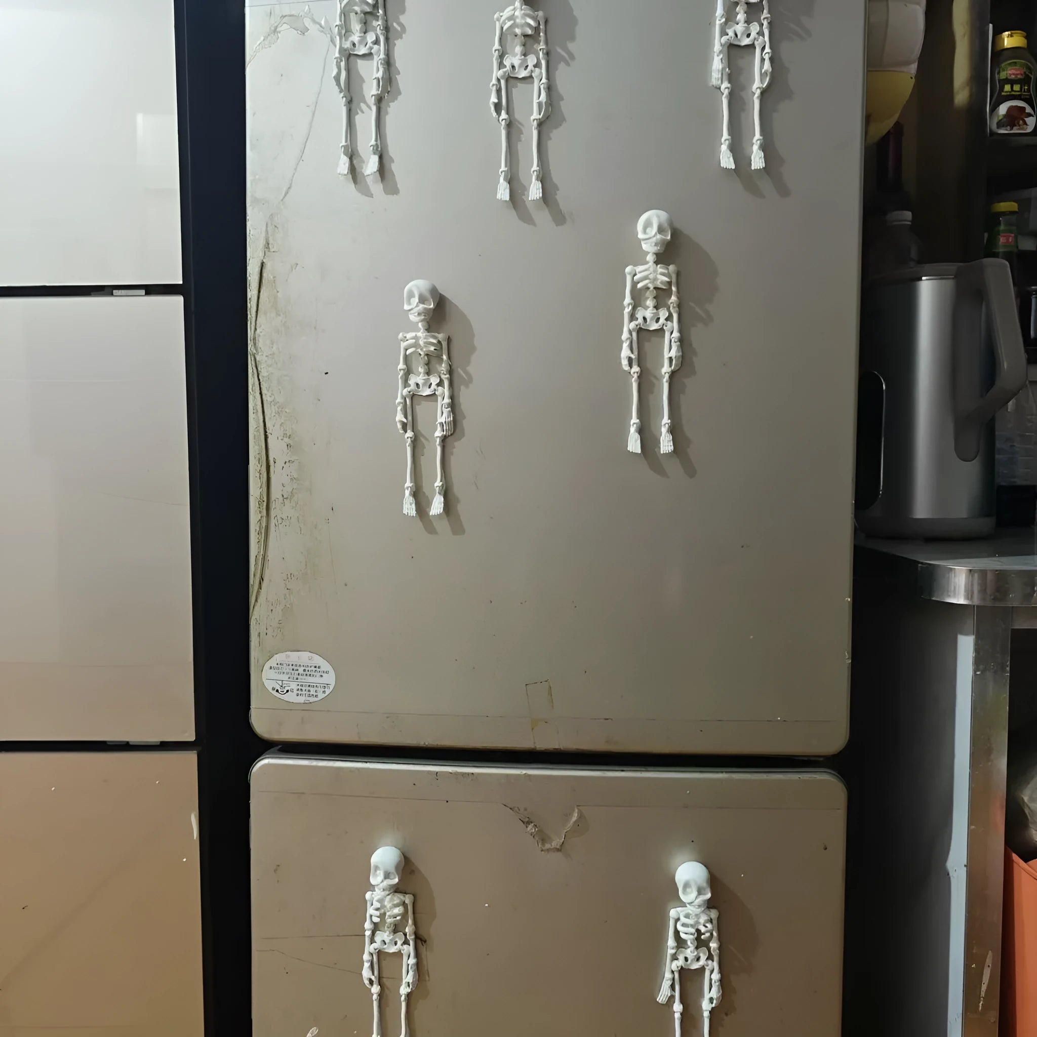 3D printed white skull refrigerator magnet Halloween ornament measuring 18cm tall.