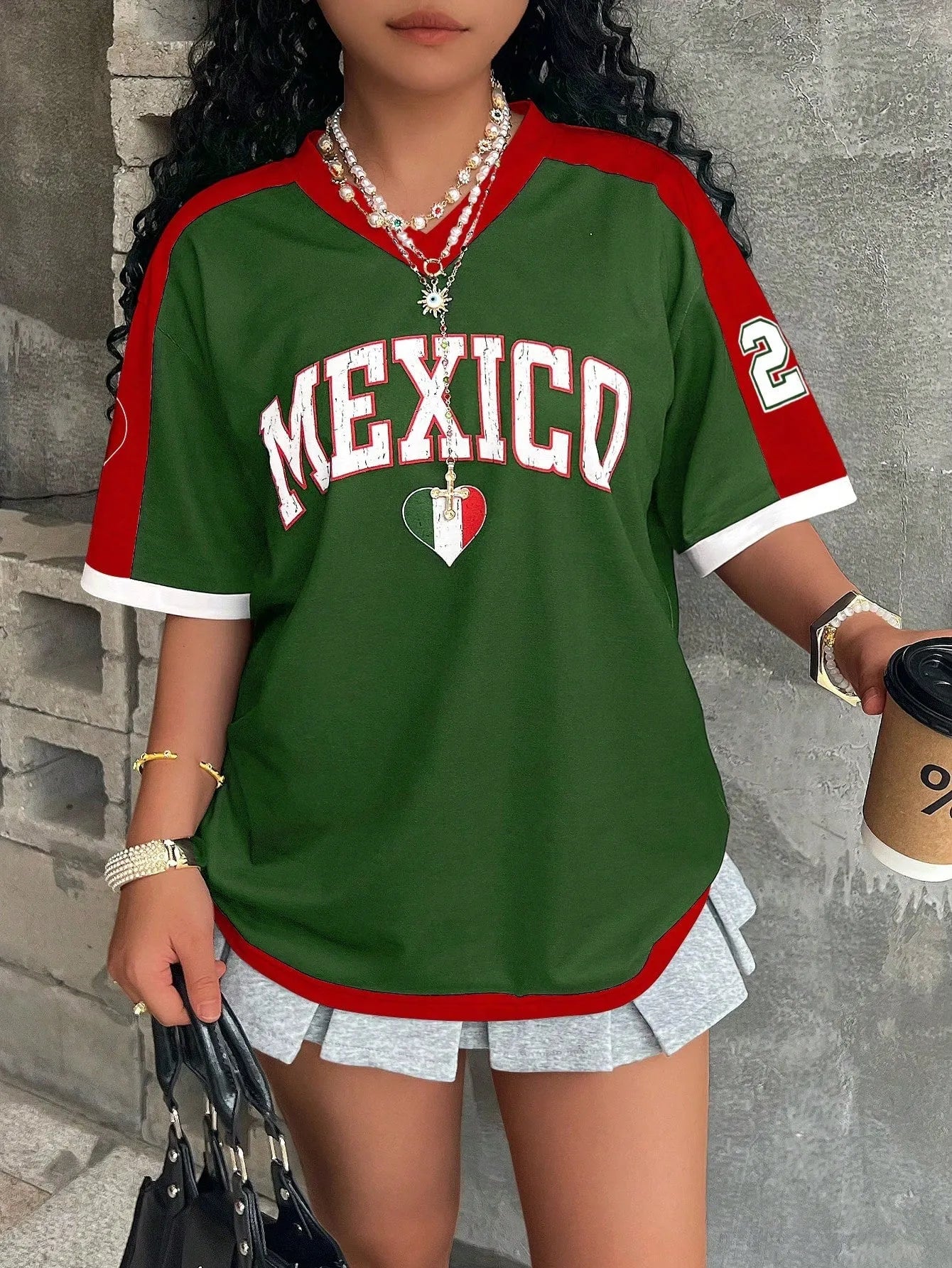 Women's loose fit short sleeve V-neck T-shirt with bold 3D letter printing on the front.