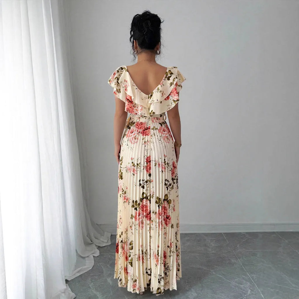 Apricot floral print women's dress with V-neck, ruffled sleeves, and a high-waisted swing skirt.