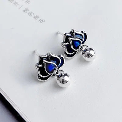 Silver Needle alloy lotus seedpod ear studs with tassel detail, 1.2cm wide.