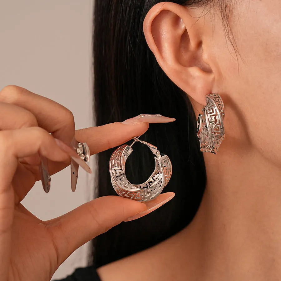 Geometric hollow stud earrings with twisted round design in electroplated copper