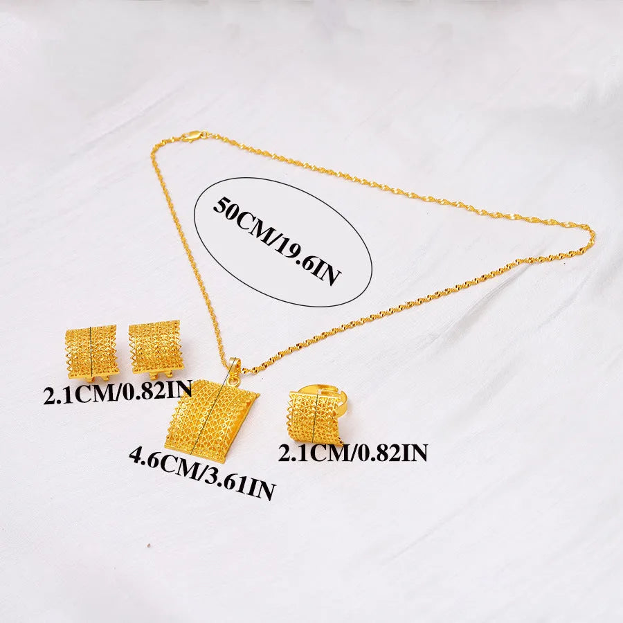 Golden copper bridal jewellery set featuring a necklace, pair of earrings, and a ring on a display.
