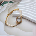 Women's light gold bracelet watch with a freshwater pearl dial and stainless steel strap