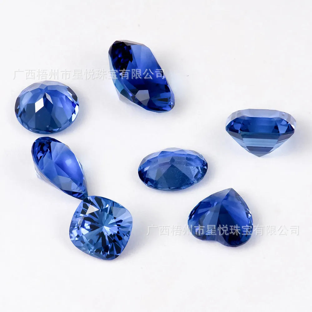 Royal blue gemstone in heart shape with modern cut on neutral background