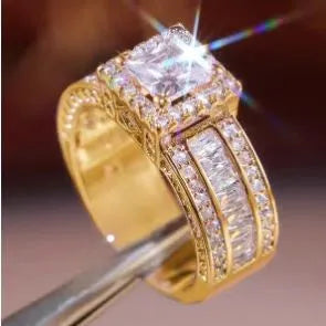 Geometric round women's alloy ring in gold or white electroplated finish.