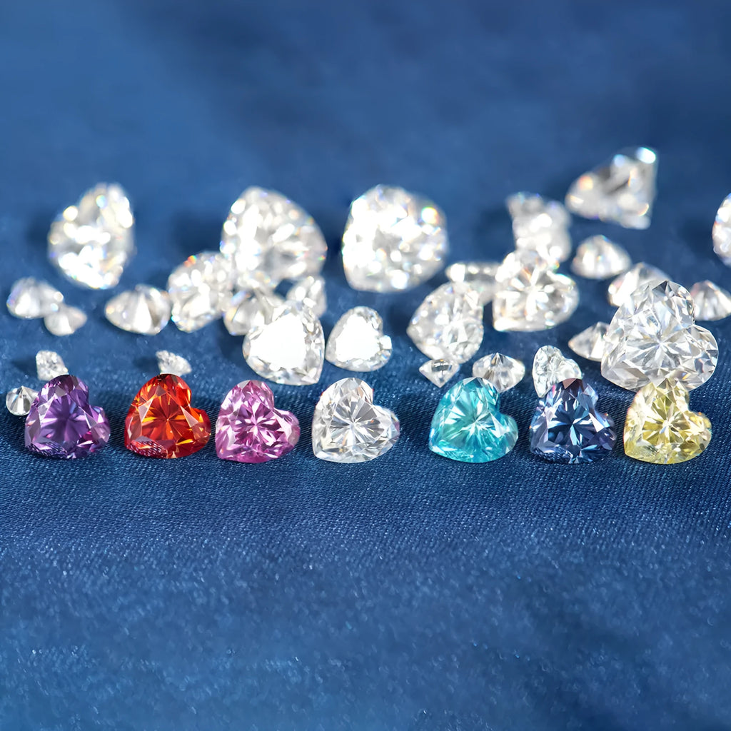 Colourful heart-shaped moissanite gemstones in red, blue, yellow, and pink for jewellery making.