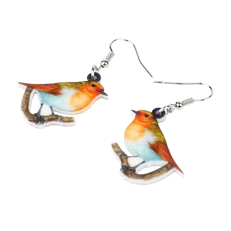 Close-up of blue titmouse and snake geometric design on women's acrylic pendant earrings.