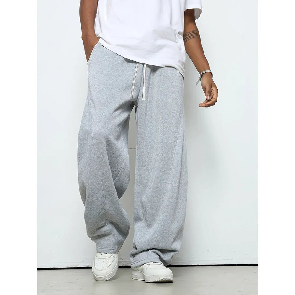 Men's straight-leg polyester casual trousers in black with a drawstring elastic waistband.