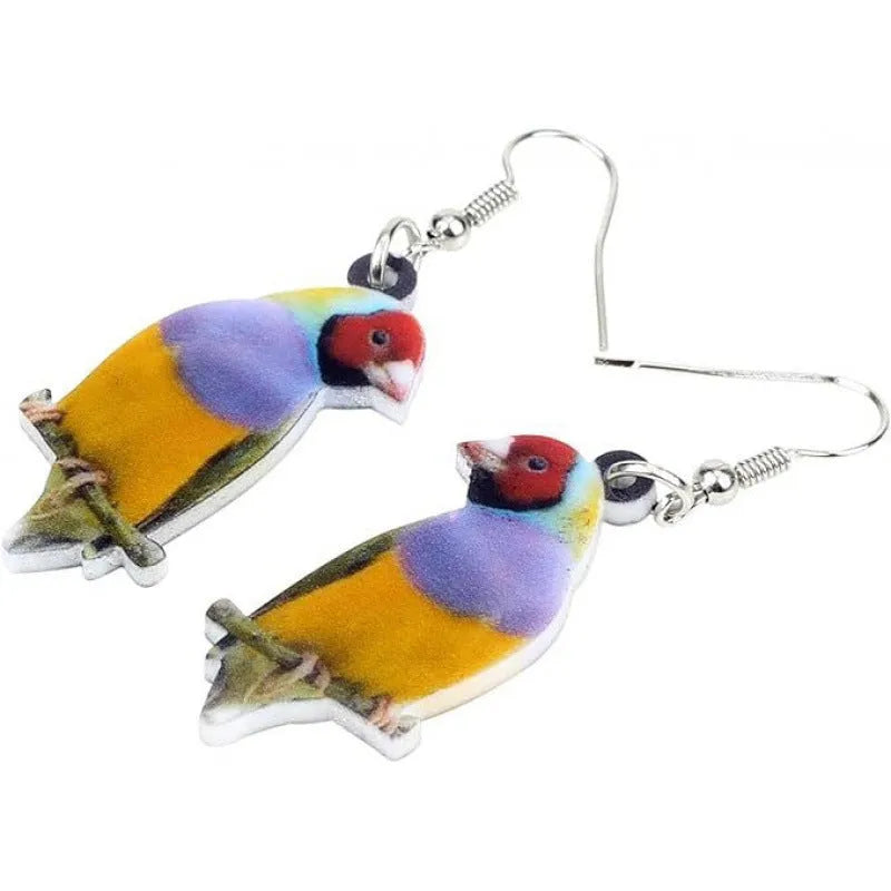 Close-up of blue titmouse and snake geometric design on women's acrylic pendant earrings.