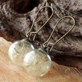Transparent 16mm glass ball earrings with dandelion seed design on silver French hooks
