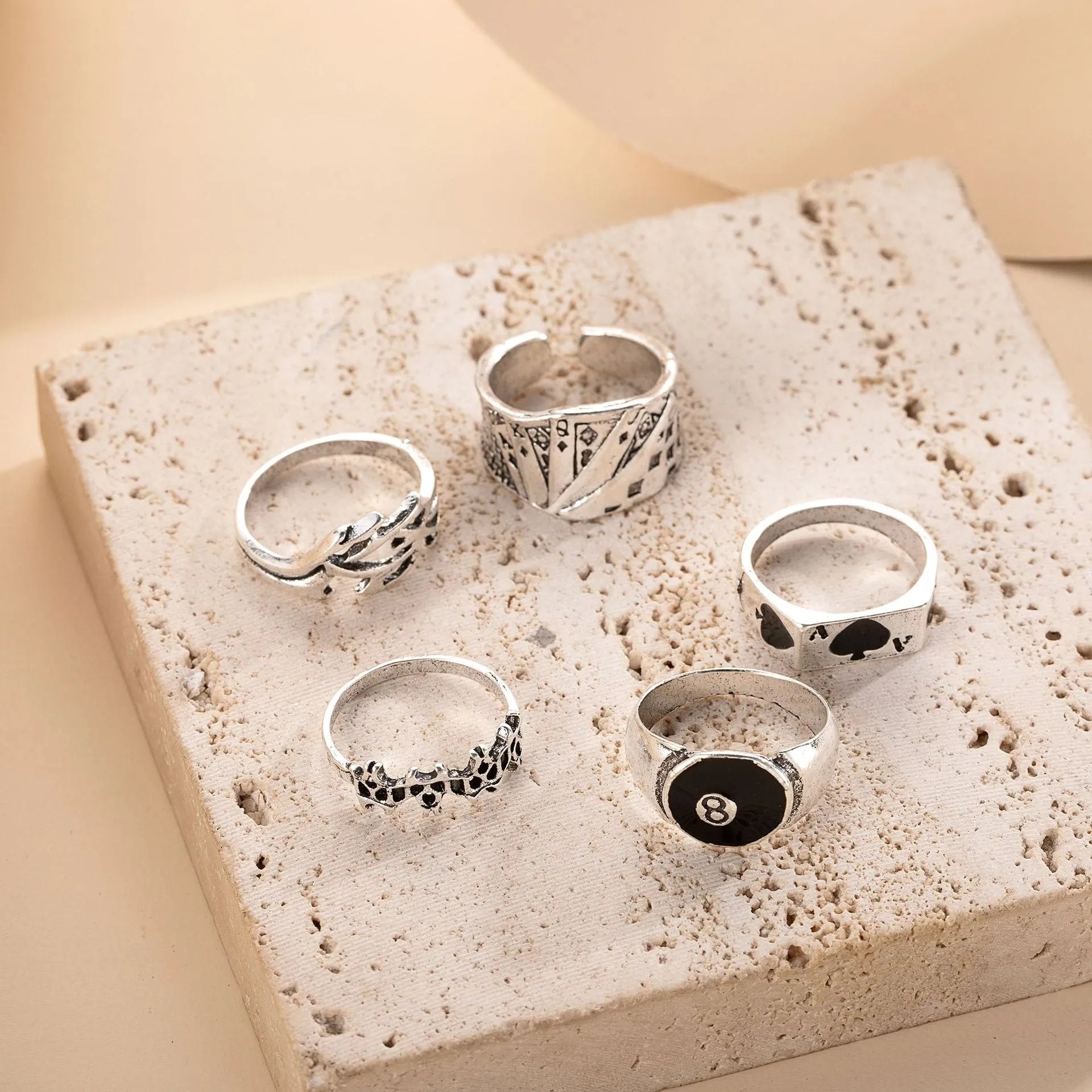 Black alloy poker ring with raised spade card design on adjustable band