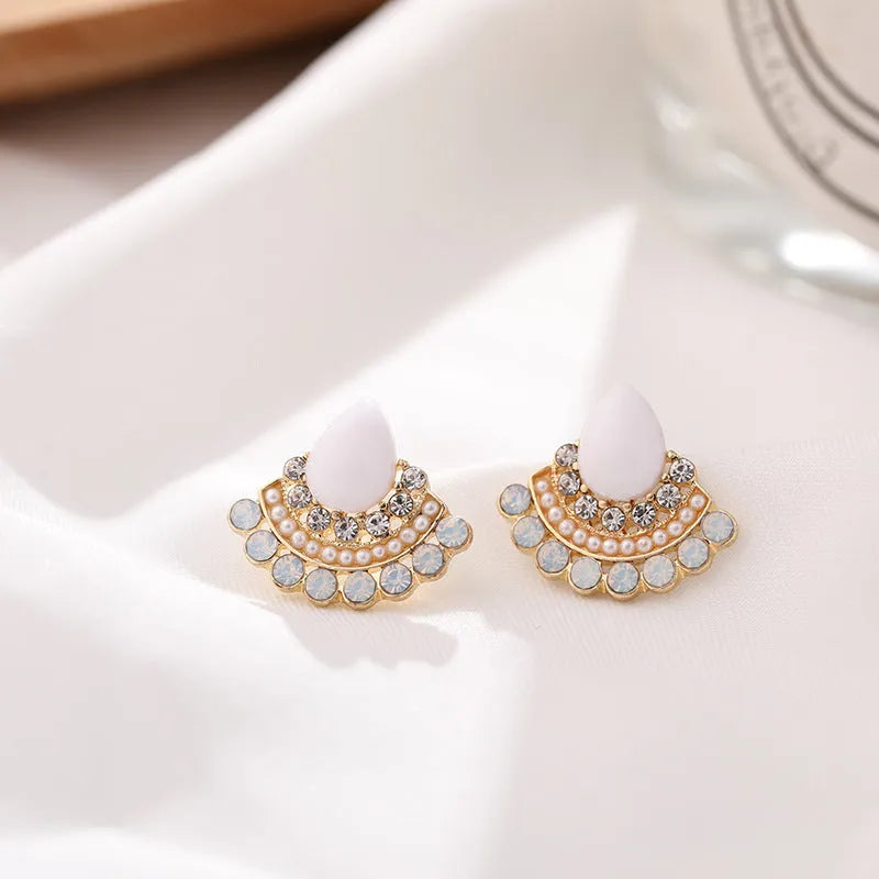 Retro fan-shaped silver colour alloy earrings with rhinestone and opal decorative details.