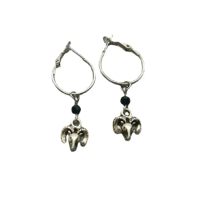 Silver alloy round hoop earrings with a detailed Tibetan antelope silhouette design.
