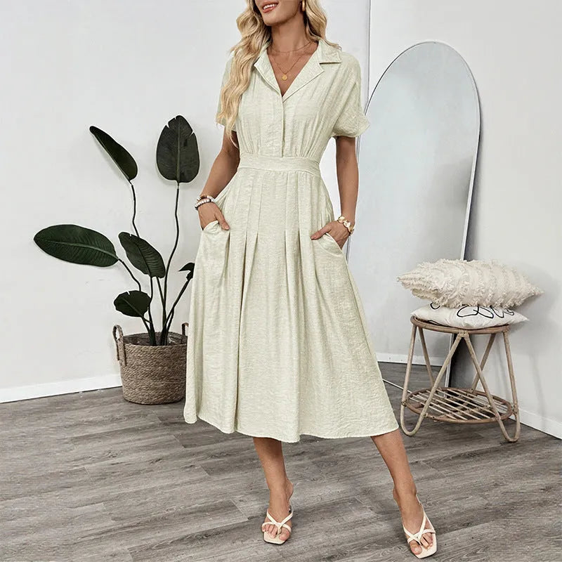 Light green shirt dress with lapel collar, waist tie, and side pockets