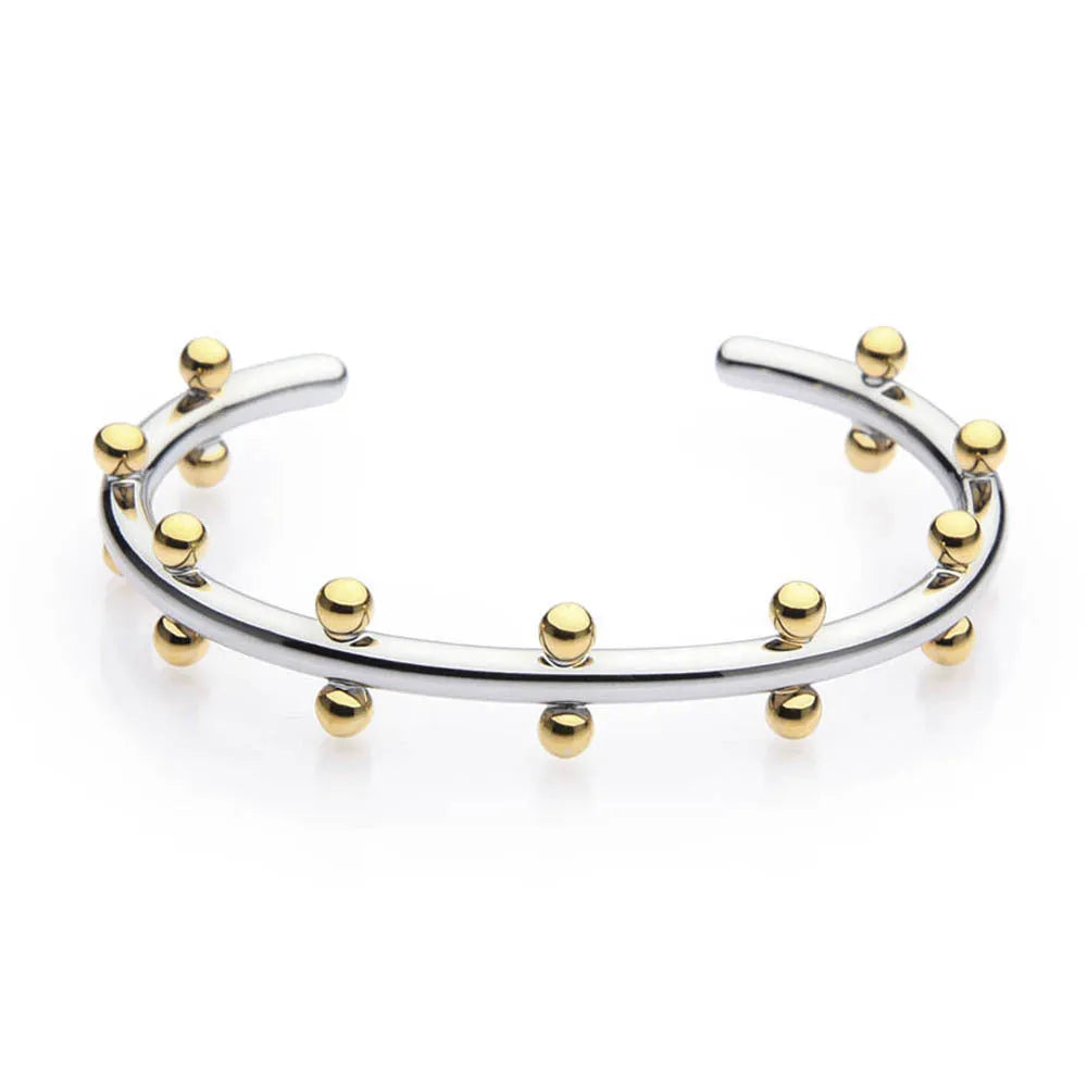 Close-up of stainless steel C-shaped textured bean beads in gold, steel, and steel-gold colours.