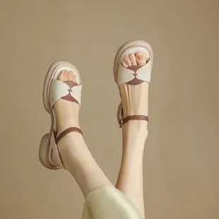 Women's khaki platform sandals with a chunky heel and open toe design on a rubber sole.