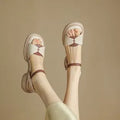 Women's khaki platform sandals with a chunky heel and open toe design on a rubber sole.