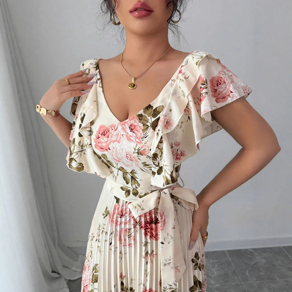 Apricot floral print women's dress with V-neck, ruffled sleeves, and a high-waisted swing skirt.