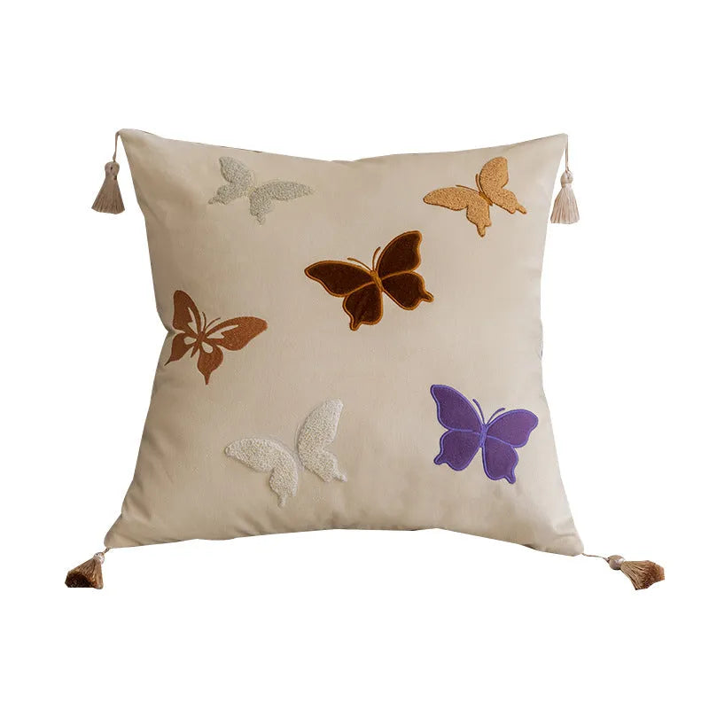 Square beige cushion with detailed black butterfly embroidery in a Chinese style.