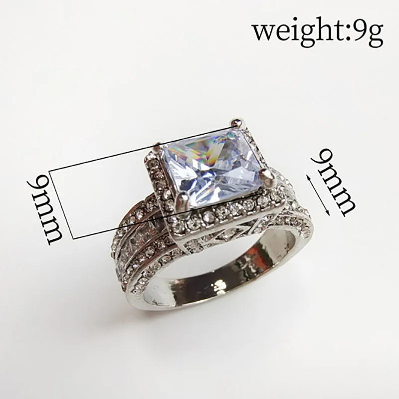 Geometric round women's alloy ring in gold or white electroplated finish.