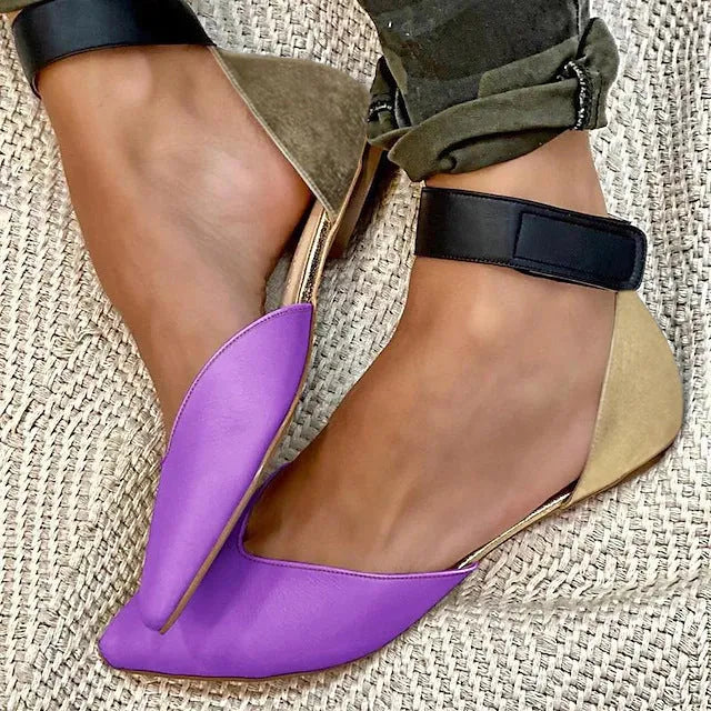 Women's beige velcro sandals with a hollowed flat heel design on a white background.
