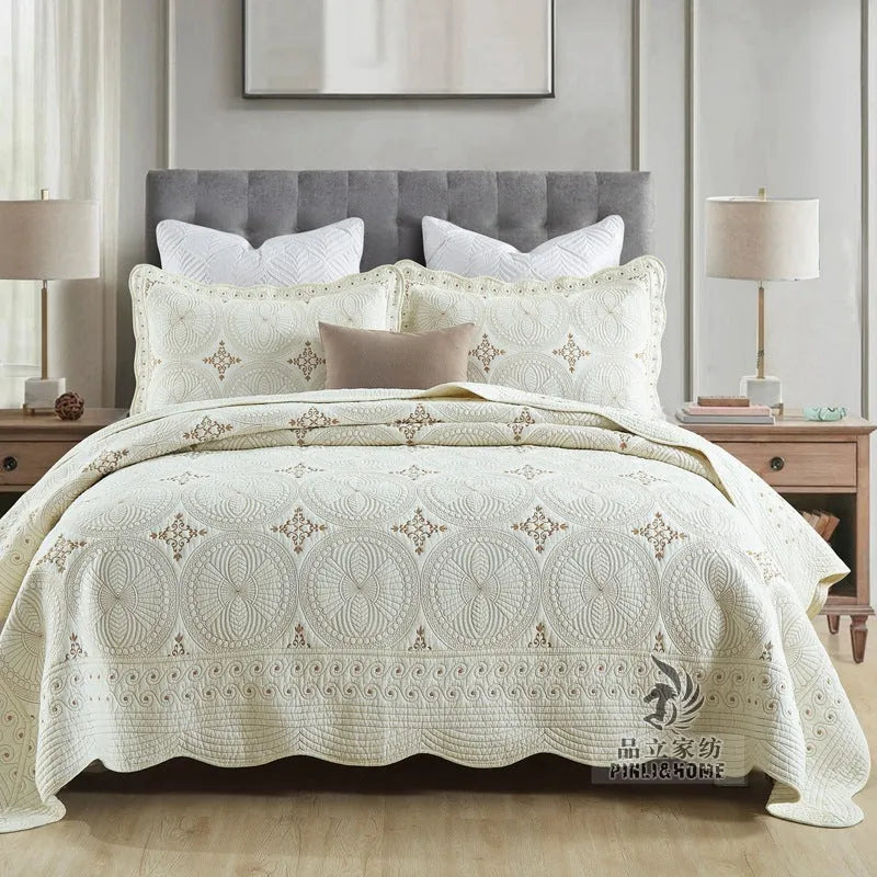 Pure cotton embroidered bed cover set with pillowcases on a double bed.